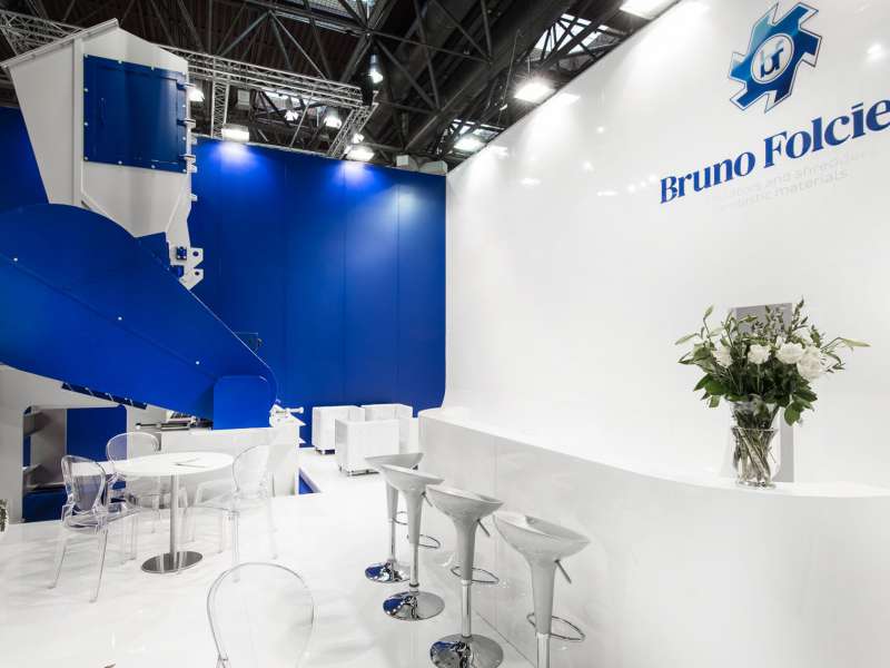 exhibitors' furniture and customized tables, highly customized solutions, videowall and interactive totem, lighting engineering, concept and design