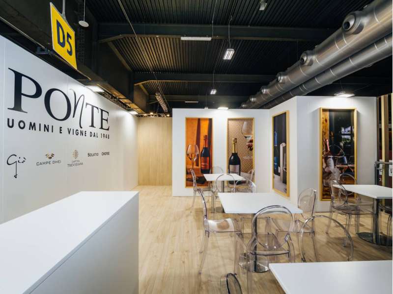 exhibitors' furniture and customized tables, stand with mezzanine, made in Italy, two-levels booth, form group